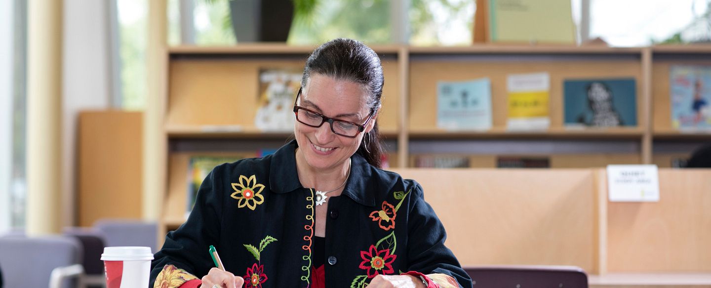 photo of an author signing books